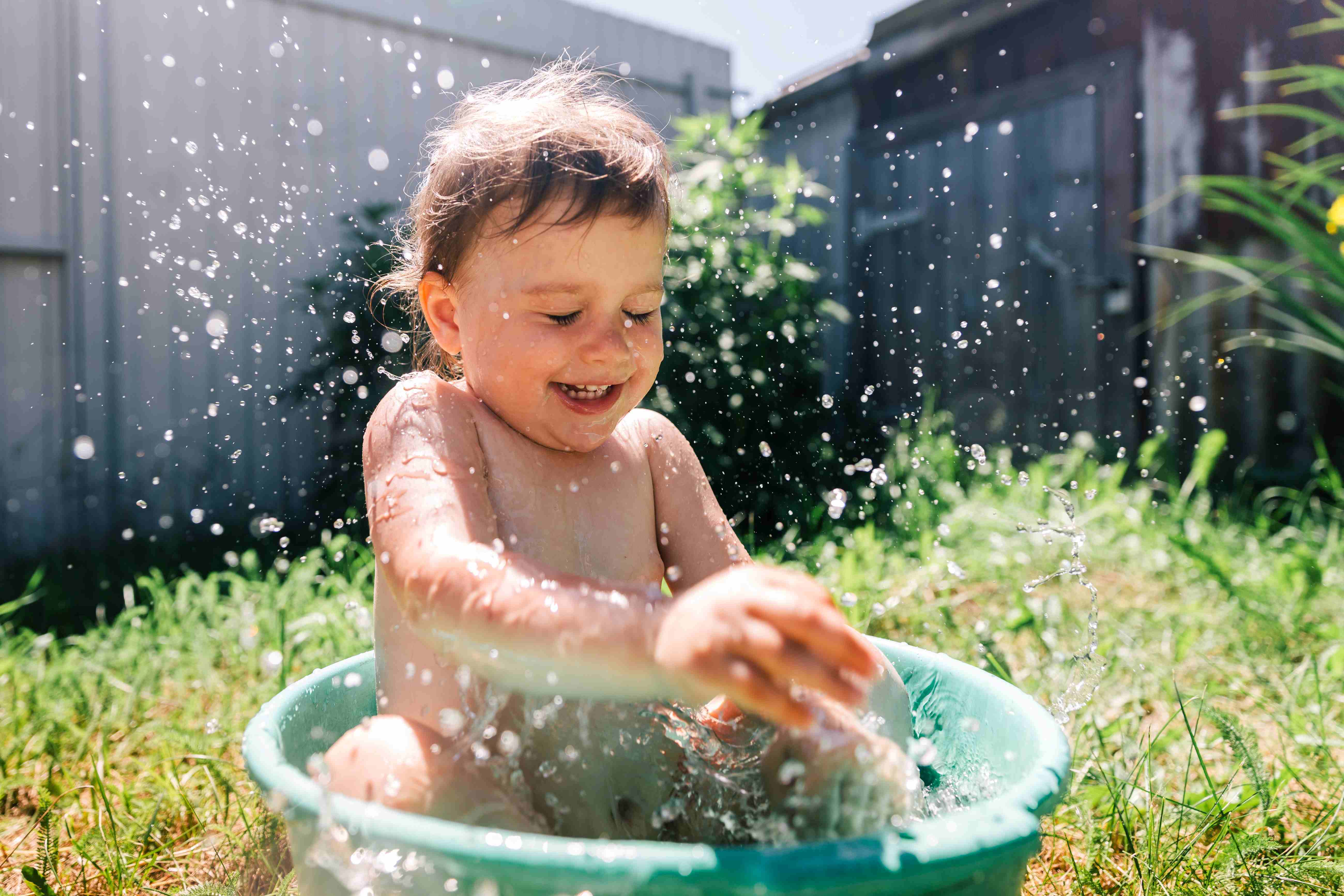 toddler playing in water